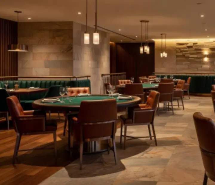 Warm interior of TheGoldenFfold poker lounge with sandstone, bronze finishes and elegant tables